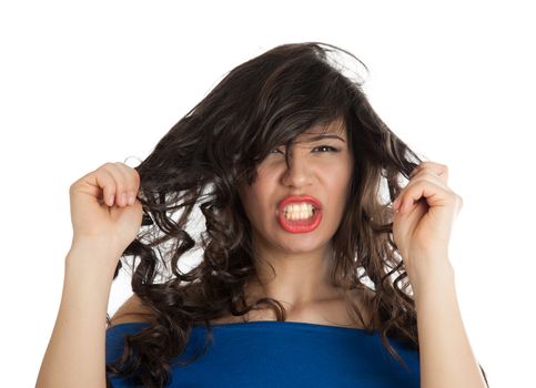 Angered by a woman screaming and tearing his hair
