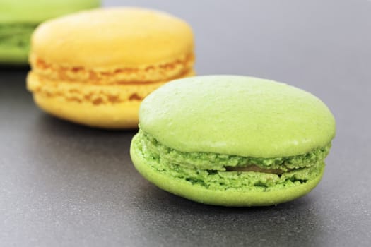 two green and yellow macaroons in kitchen