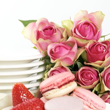 Dessert on valentine's include macaroons, coffee and strawberry