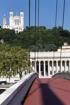 Lyon with red footbridge on Saone river and basilica
