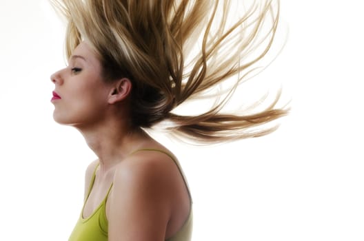 portrait of a woman with hair flying in the air on white background