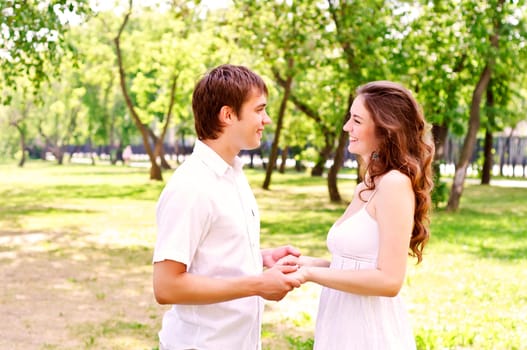 couple holding hands in the park, spending time with loved ones