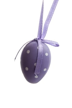 Purple easter egg isolated on white background