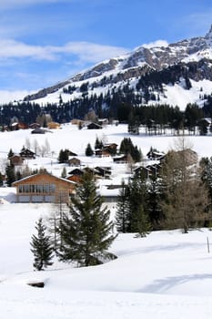 Alps mountains landscape with chalets at the Mosses by beautiful day, Switzerland