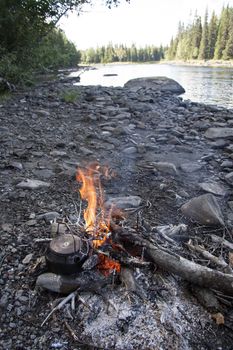 Camp fire in wild mountain