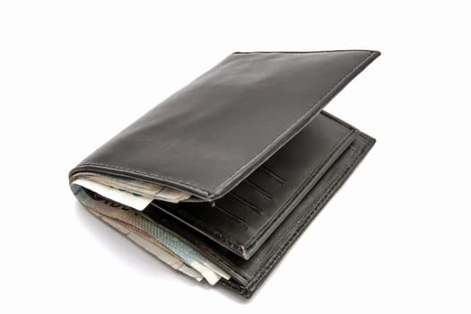 Wallet and currency closeup on white background 
