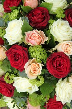 Bridal flower arrangement in red, pink and white, big roses