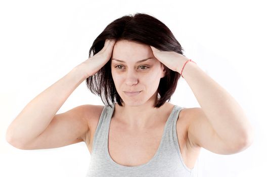 young woman with headache making massage to avoid pain