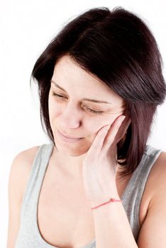 young woman with tooth ache making massage to avoid pain