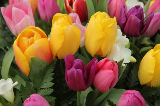 Mixed spring bouquet with tulips in various bright colors