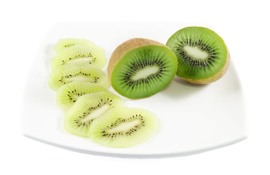 Piece of kiwi fruit and slices over white isolated background