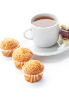 bar of chocolate,tea and muffin isolated on white