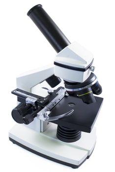 Close up view of a Microscope over white isolated background