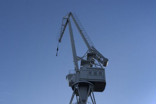 Gray Dock Crane over blue sky background