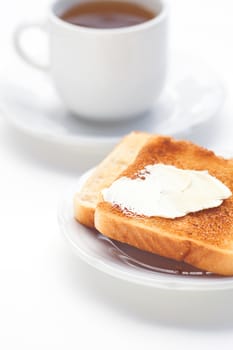 tea and toast with butter isolated on white