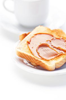 tea and toast with caramel isolated on white