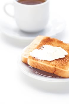 tea and toast with butter isolated on white