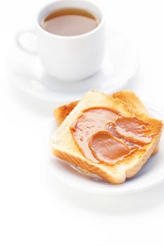 tea and toast with caramel isolated on white