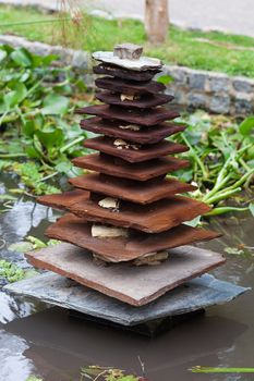 Japanese wooden pagoda in the background of green grass