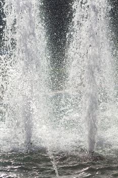 splashing water of fountain in sunlight