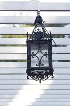 decorative lantern hanging in the arbor