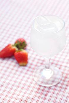 cocktail with ice, lemon and strawberry