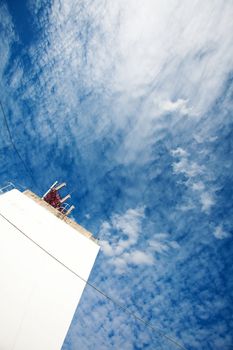 background of blue sky with clouds and the wall of the building