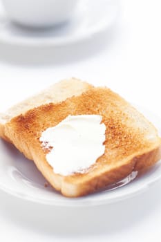 tea and toast with butter isolated on white