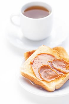 tea and toast with caramel isolated on white