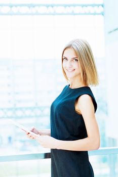 A portrait of a young business woman in an office