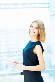 A portrait of a young business woman in an office