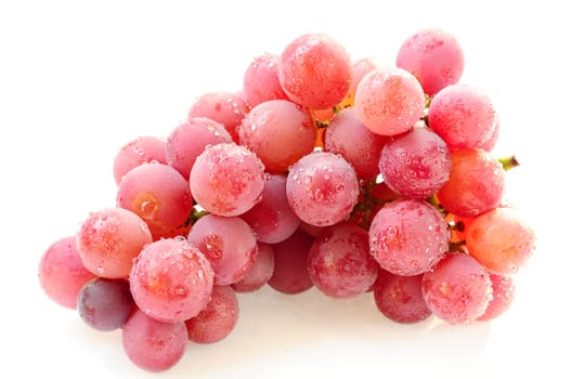 Fresh purple grapes on a white background