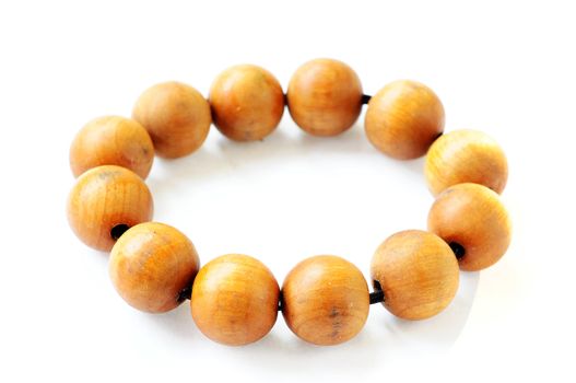 Wooden prayer beads on a white background 