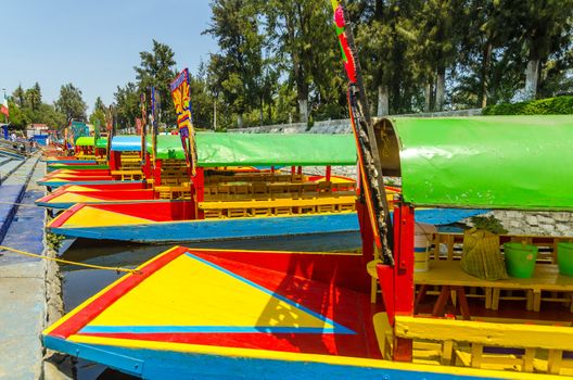 Brightly colored boats docked in Xochimilco canals in Mexico City