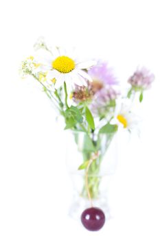 bouquet of wild flowers and cherry with green leaf