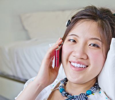 Asian woman talking on the phone