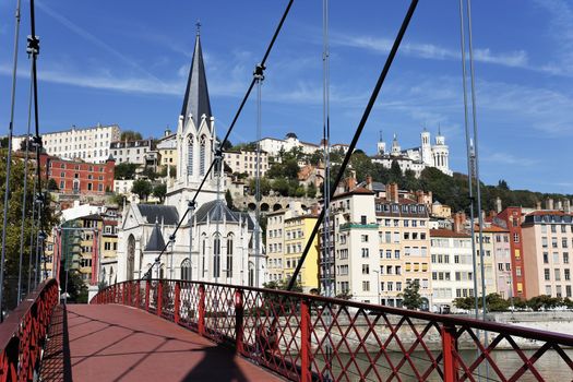 Lyon city with red footbridge on Saone river