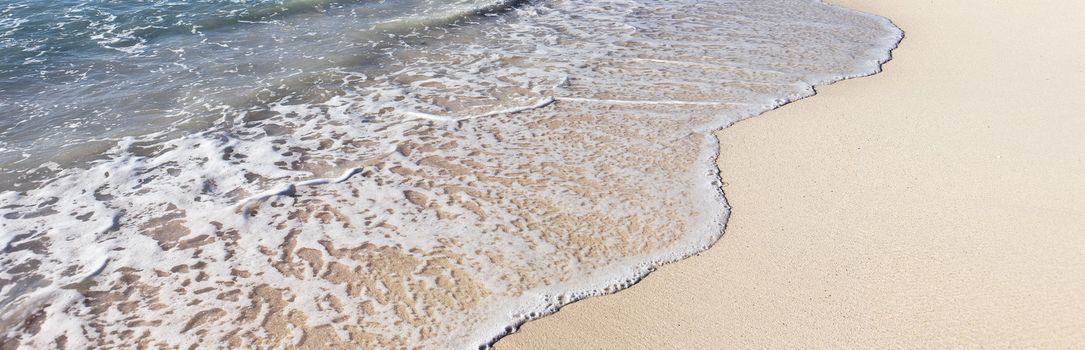 part of mexican beach with wave on the sand, panoramic view