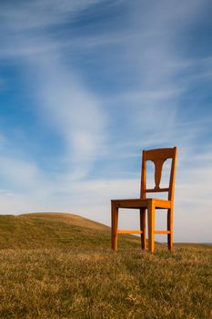 Lonely chair on the empty golf course in autumn