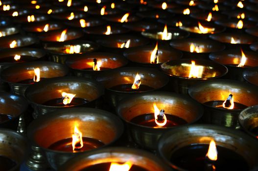 Burning oil lamps in a traditional Chinese ancient temple