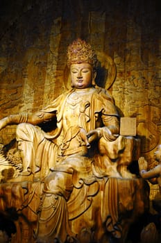 Wood-carving Buddha statue in a traditional Chinese ancient temple