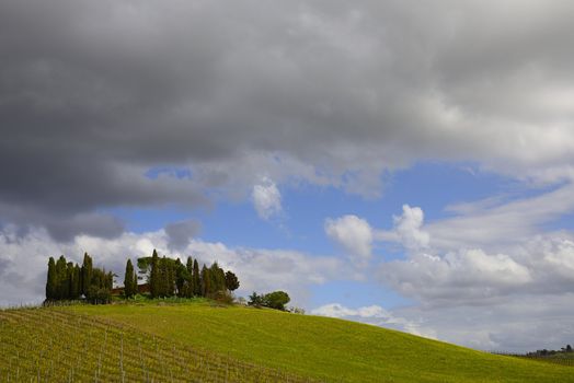 Dark clouds on countryside, San Quirico d�Orcia, Tuscany, Italy