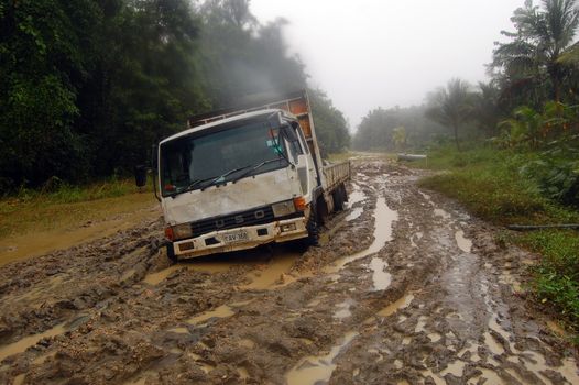 Stuck truck at muddy road, Papua New Guinea