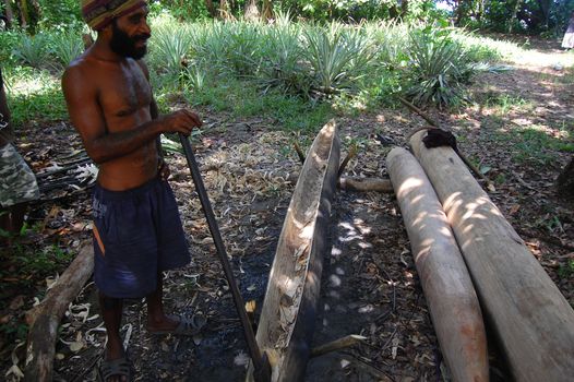 Man builds canoe on 08 of May 2011.
Si-Ini village. Central Province. Papua New Guinea