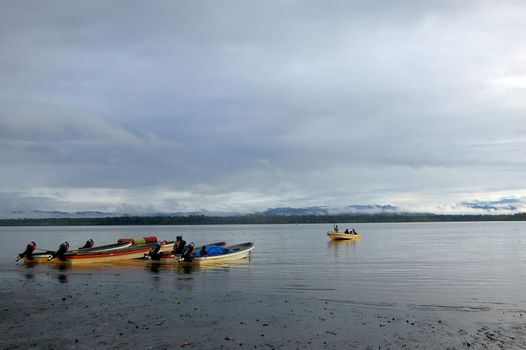 Motor boats at river coast, papua New Guinea