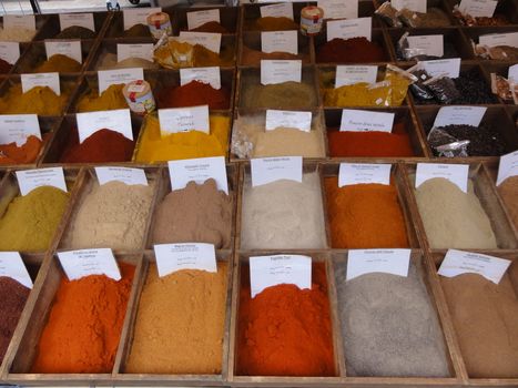 photo of many spices at a market stall