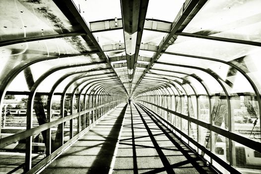 Striking monochrome image of a pedestrian footbridge