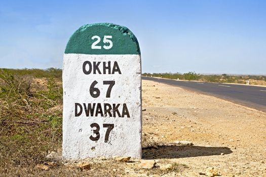 Dwarka Roadtrip. Gujarat India, the 37 kilometers Milestone to Dwarka on the state highway 25 which runs through a barren part of the country