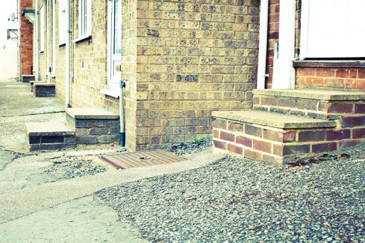 Retro toned image of concrete steps of urban houses
