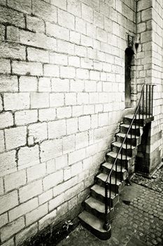 Dramatic monochrome image of a medieval staircase